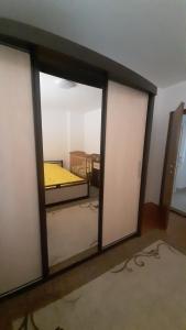 a room with three sliding glass doors in a room at Apartman Vule in Pale