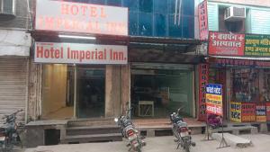two motorcycles parked in front of a hotel imperial inn at Hotel Imperial Inn in Ajmer