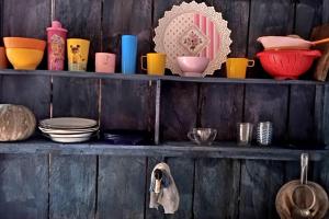 a wooden shelf with bowls and plates and bowls at Private Beach Jungle Cabañas in Manacapuru