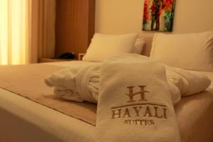 a pile of towels sitting on top of a bed at The Presidential Suit 2BR Apartment with Gym and Bar in Jounieh