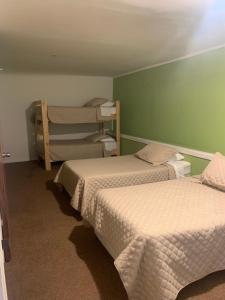 Postel nebo postele na pokoji v ubytování Hostal Casa Alegre