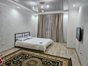 Cama o camas de una habitación en 2 комнатная квартира