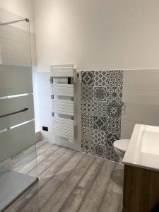 a bathroom with a toilet and a sink and a shower at Maison pour séjour in Mouzay +7 photos