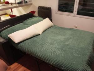 Una cama o camas en una habitación de Casa Buda