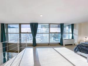 Ένα ή περισσότερα κρεβάτια σε δωμάτιο στο Loft32