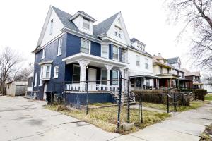 a blue house on the side of a street at 5 Bedroom Holiday Getaway Museums Galleries in Detroit