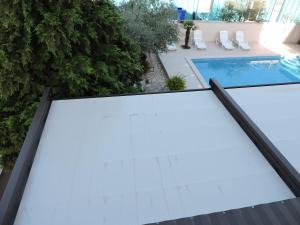 an overhead view of a swimming pool on a building at Berat Apartment in Vodnjan