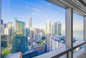 an office window with a view of a city at Amazing Four Seasons Resort With Great View in Miami