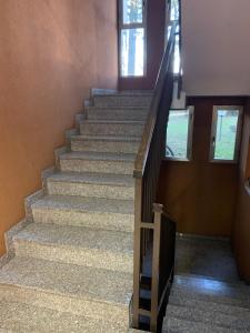 a staircase in a building with a stair case at Appartamento brevi periodi "Pedrini's Welcome Home" in Bergamo