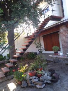 a set of stairs leading to a house with potted plants at CASA Don Manuel in Miramar