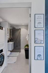 a hallway with a bathroom with a toilet and a sink at Outstanding Boutique-Designer Apartment - private Rooftop Terrace - fully equipped in Zurich