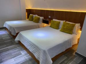 Postel nebo postele na pokoji v ubytování Hotel DABA