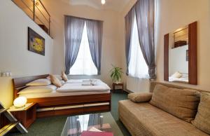 Postel nebo postele na pokoji v ubytování Hotel RICHTR
