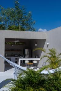 a kitchen and dining area of a house at Casa SANA in Puerto Escondido