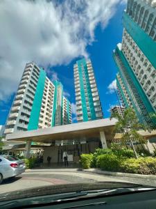 a view of a building with tall buildings at Mesavirre Garden Residence in Bacolod
