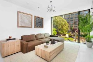 a living room with a couch and a coffee table at Luxurious Soho Apartment~ 2 Bedroom 2 Bathroom in New York