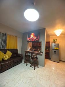 a living room with a couch and a table at Paradise Vista in Bamboo Market