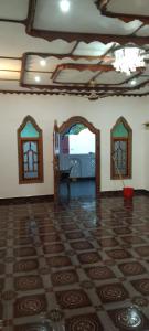 a living room with a tile floor and a doorway at Dino Enjoy Property in Trincomalee