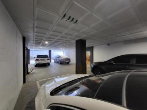 a garage with two cars parked in it at Mokhwa Motel in Icheon
