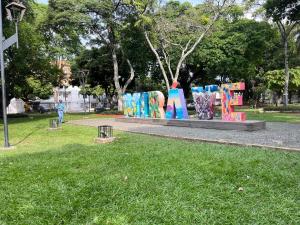 a park with a playground in the grass at Apartaestudio Encanto Pacífico in Cali