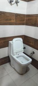 a bathroom with a toilet in a room at V.S guest houes in Palwal