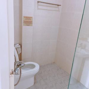 a bathroom with a toilet and a sink at MILAND HOTEL in Can Tho +23 photos