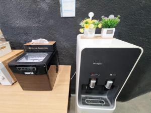 a coffee machine sitting on top of a counter at Residence YeoYu Uijeongbu Station in Uijeongbu