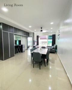 a large living room with a table and chairs at Sandakan Ijm pool view condo in Sandakan