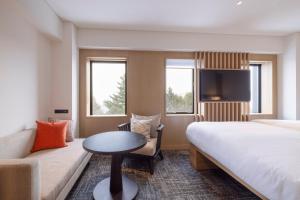 Nozo Hotel客房内的一张或多张床位