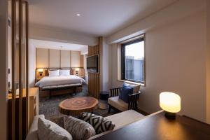 Nozo Hotel客房内的一张或多张床位