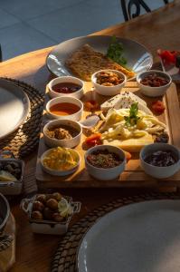 a table with a tray of food on a table at Hotel Marina Bay Göcek in Göcek