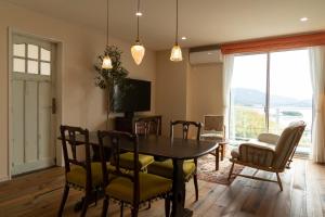 a dining room with a table and chairs at La Classe Angel Road 2 - Vacation STAY 71507v in Fuchisaki