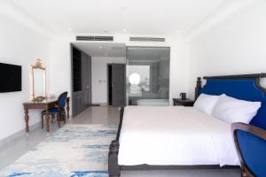 Postel nebo postele na pokoji v ubytování Quang Minh Riverside Hotel Danang