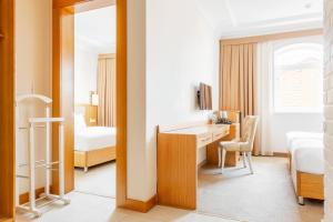 Кровать или кровати в номере Praga Hotel