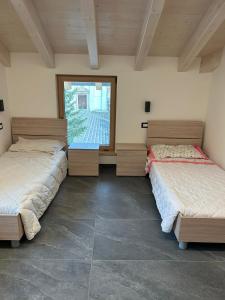 Postel nebo postele na pokoji v ubytování CASA ANITA