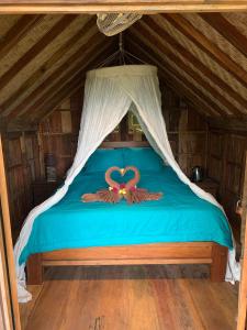 Uma cama ou camas num quarto em Villa Kepuh