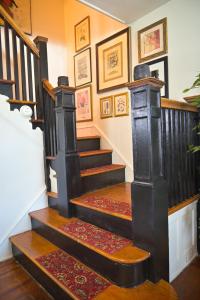 a set of stairs in a living room with at Garden Oasis in Historic Germantown, Philadelphia in Philadelphia