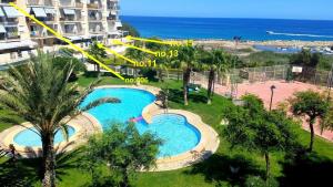 an aerial view of a swimming pool at a resort at Sol y Mar, Cala Merced in El Campello