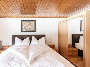 Ένα ή περισσότερα κρεβάτια σε δωμάτιο στο Ferienhaus Alpenflora