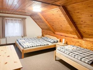 Postel nebo postele na pokoji v ubytování Chalupa Rozálka