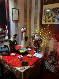 a table with christmas decorations on top of it at Hotel rooms & Restaurant Pirocanac in Pirot