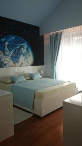 a bedroom with a large bed with a planet on the wall at Villa Elizabeth,Slano in Slano