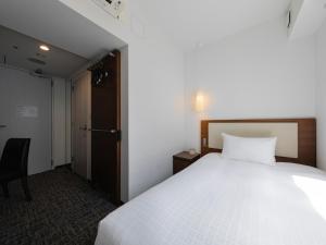 Postel nebo postele na pokoji v ubytování Tokyu Stay Shinjuku