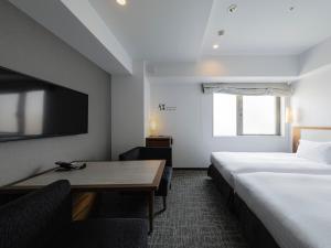 Postel nebo postele na pokoji v ubytování Tokyu Stay Shinjuku