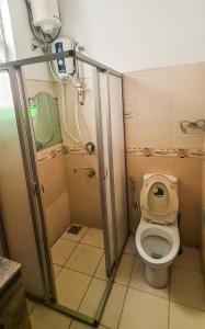 a bathroom with a toilet and a shower at Mount View Residencies in Colombo
