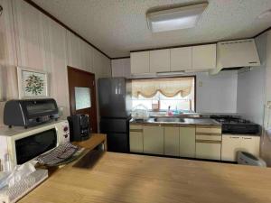 Kitchen o kitchenette sa Shallom Oiwake シャローム追分