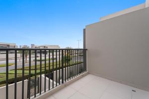 a balcony with a view of a street at Lovely 3BR Villa in Dubai EXPO in Dubai