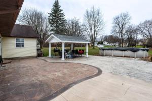 a patio with a gazebo in a yard at Fantastic Home Near DWTN/Airport in Rochester