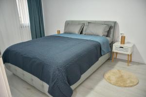 Ένα ή περισσότερα κρεβάτια σε δωμάτιο στο Apartament Eva
