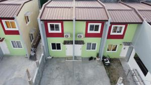 an overhead view of a house with red and green at Calapan Transient House L12 in Calapan
